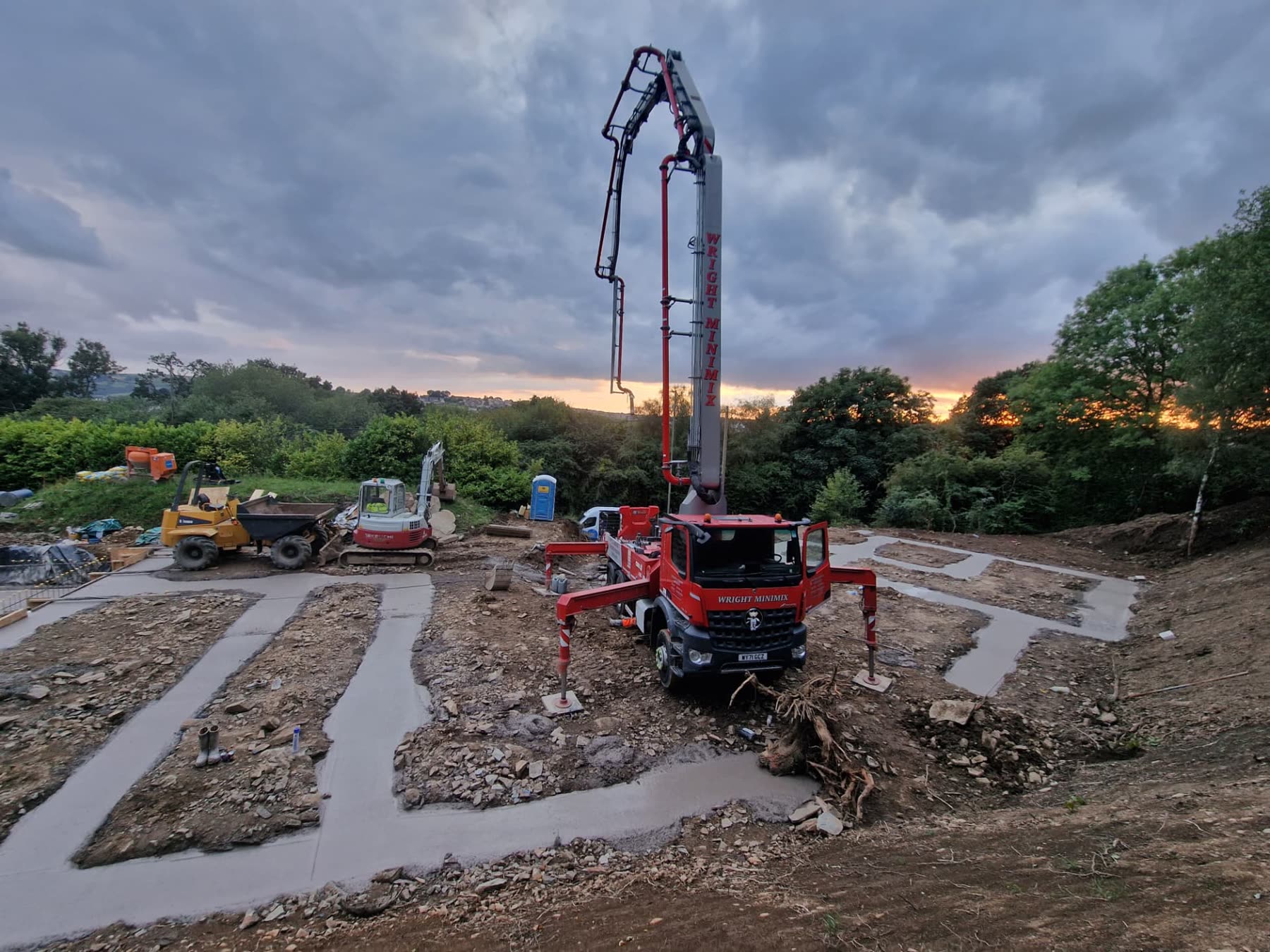 Rebar cage and shuttering for a new in-ground swimming pool excavated into a hillside